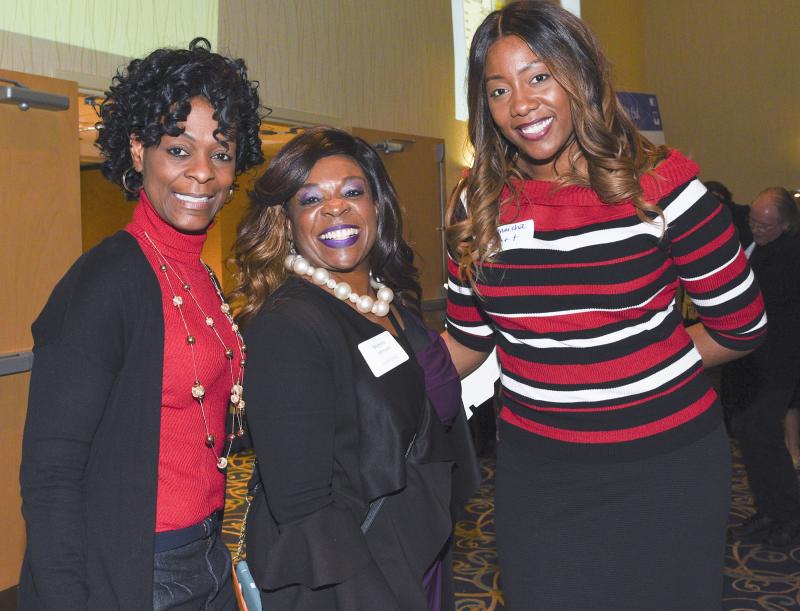 Girls Night Out 2019 honoree Michelle Johnson is flanked by 2018 honoree Sandi Hagans Morris, left, and Kaneisha Trott.